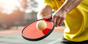 Pickleball player making a third shot drop.